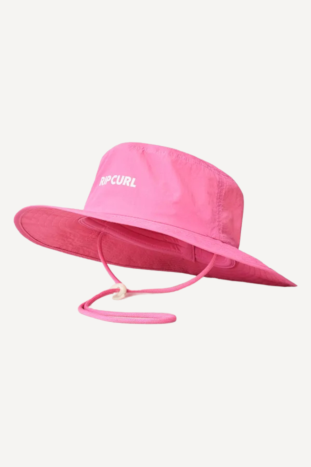 Chapeau de bain anti-UV rose UPF 50+ de Rip Curl, adapté à la plage avec cordon ajustable pour un confort optimal.